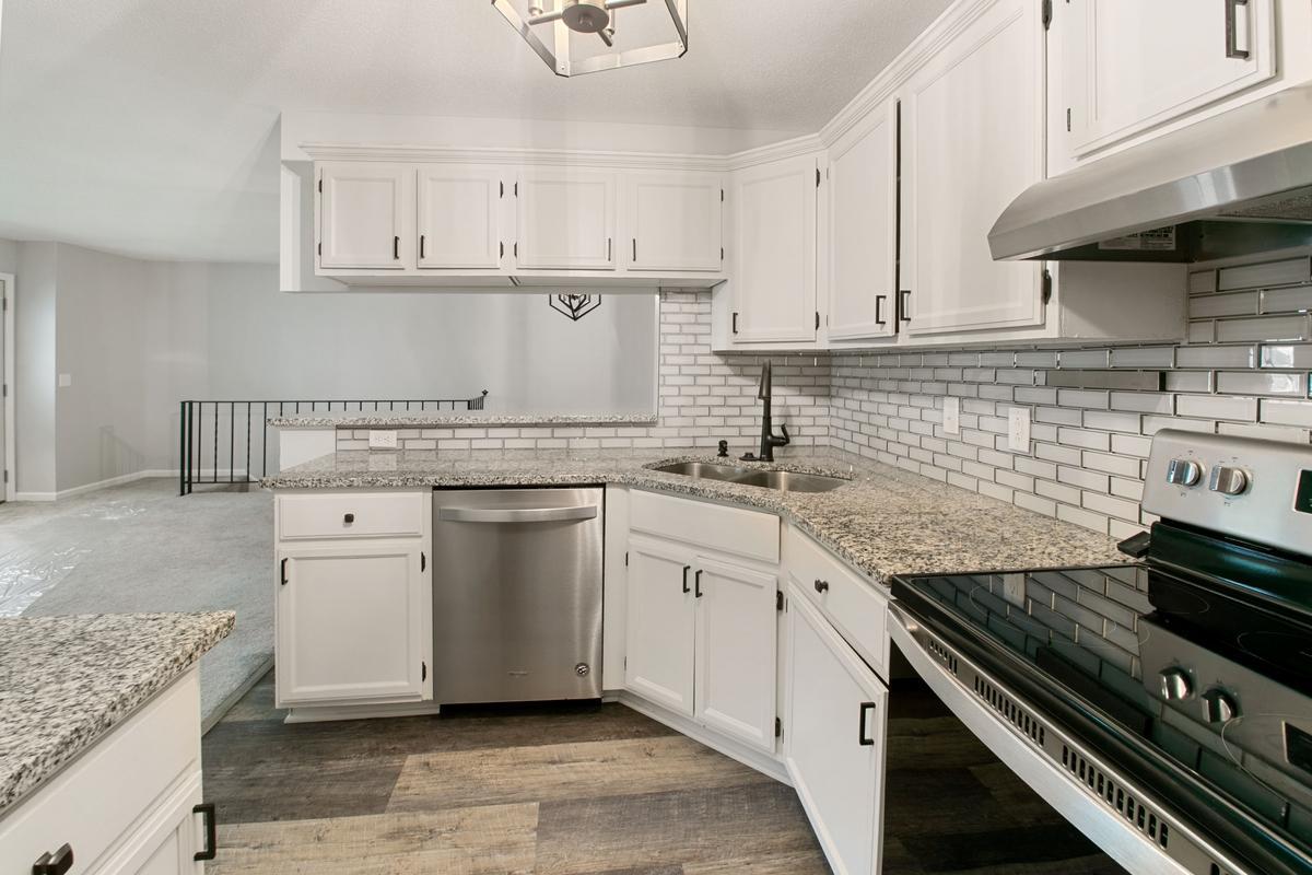 Granit counter tops, white enamel cabinets, stainless steel appliances, waterproof High Luxury vinal floors.