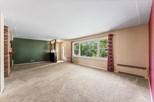 Living room with wood fire place and built-ins.