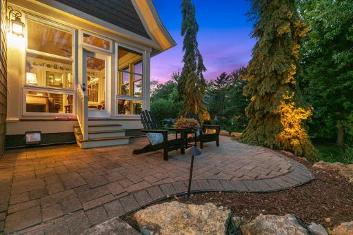 Private elevated patio seamlessly extends the three season porch into a tranquil outdoor retreat.