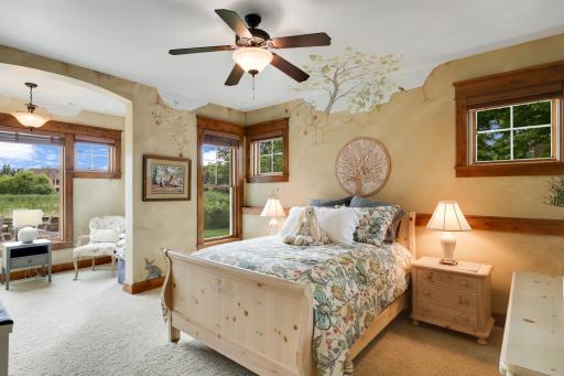 Lower level bedroom #3 with sitting area and walk in closet. Affectionally known as the bunny room. Darling!