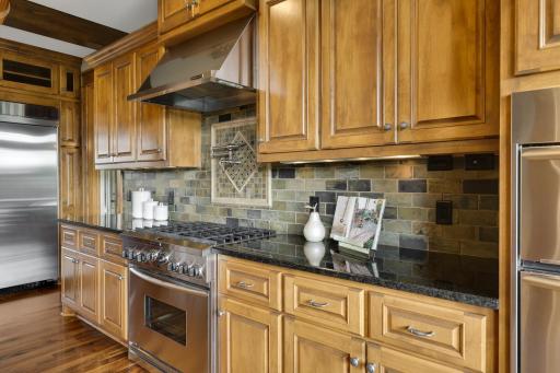 Don't miss the custom pot filler above the range and the 6 burner gas range.