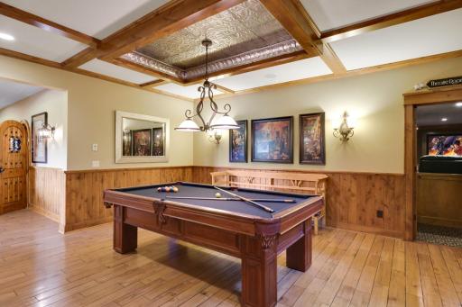 Lower-level game room with custom millwork, darts billiards area. Just off the home theater.