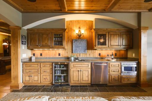 Lower level wet bar with wine fridge and dishwasher for the entertainment convenience