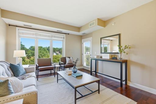 Living room that opens to private balcony