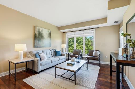 Bright living room with cherry wood floors