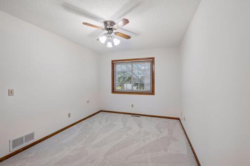 Primary bedroom with private 3/4 bathroom and walk-in closet