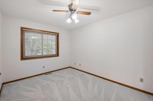 Primary bedroom with private 3/4 bathroom and walk-in closet