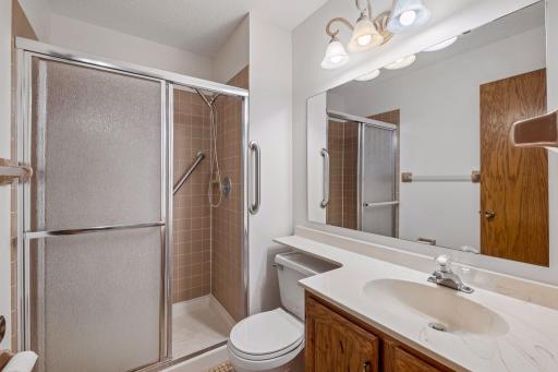 Primary bedroom with private 3/4 bathroom and walk-in closet