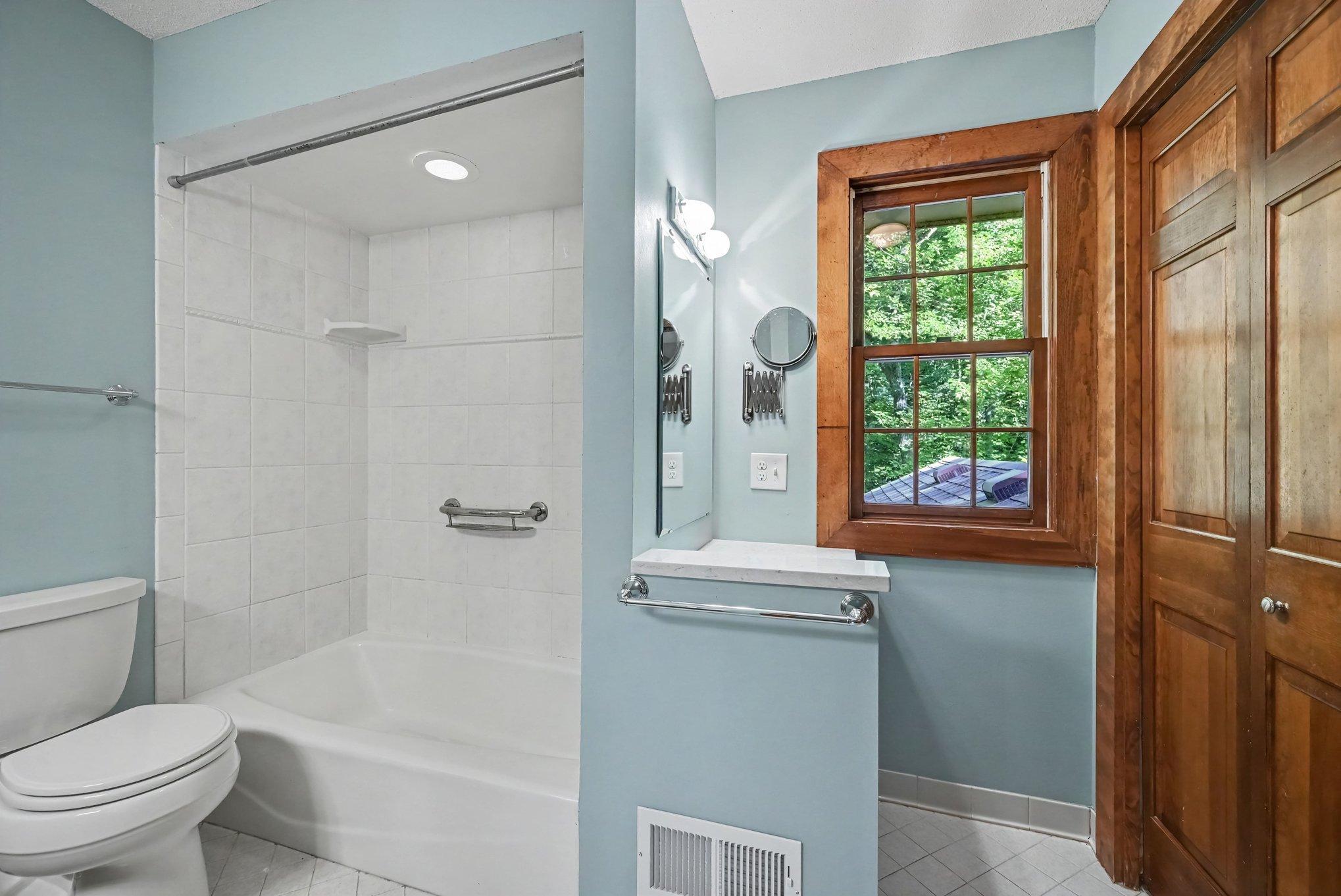 Laundry located in closet to right. Extra mirror and counter space.