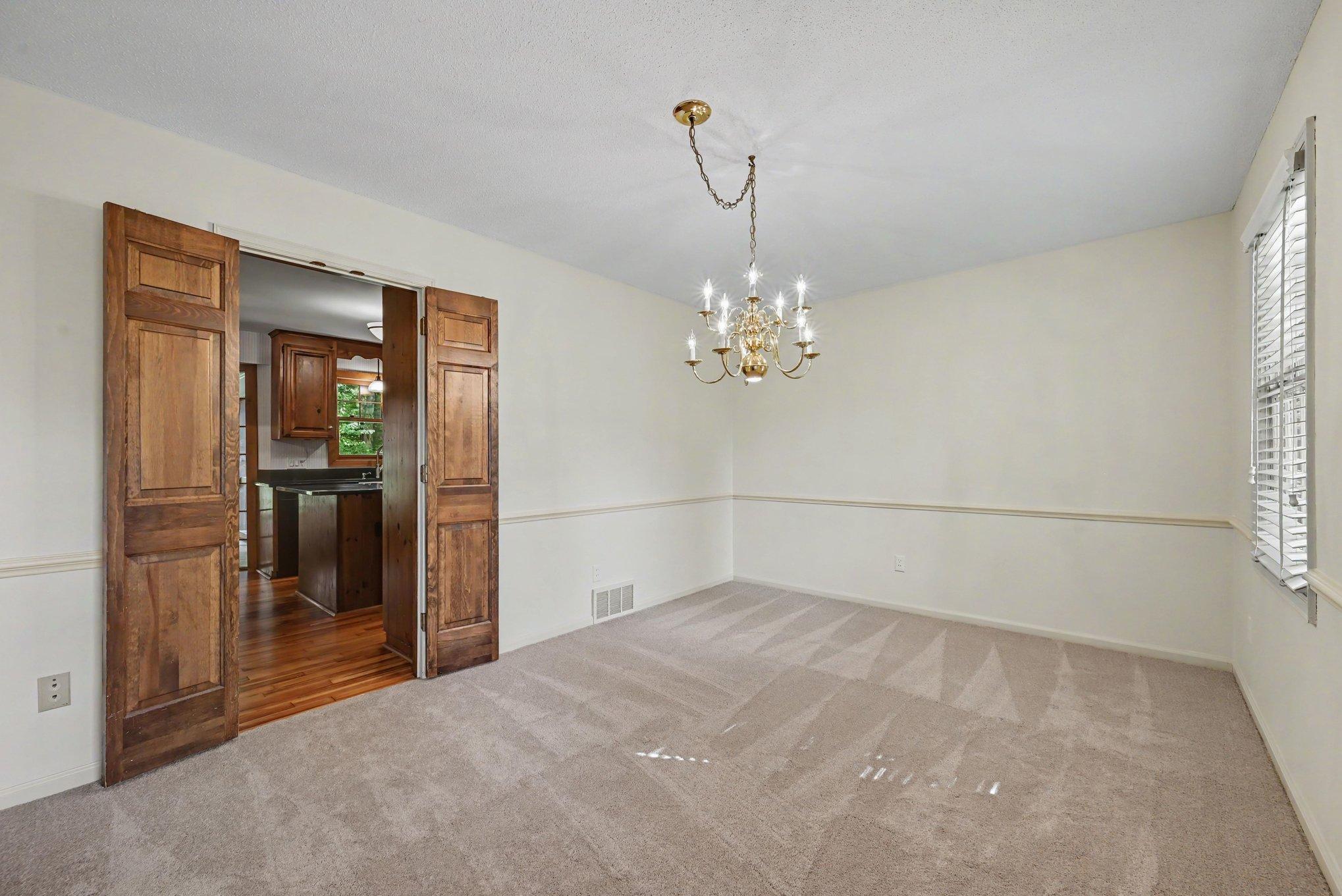 Formal dining area perfectly situated next to the kitchen. New carpet and paint!