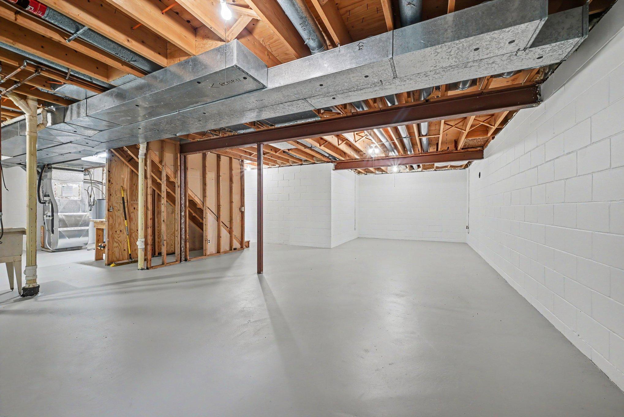 Unfinished basement just ready for finishing touches. New rim joist insulation.