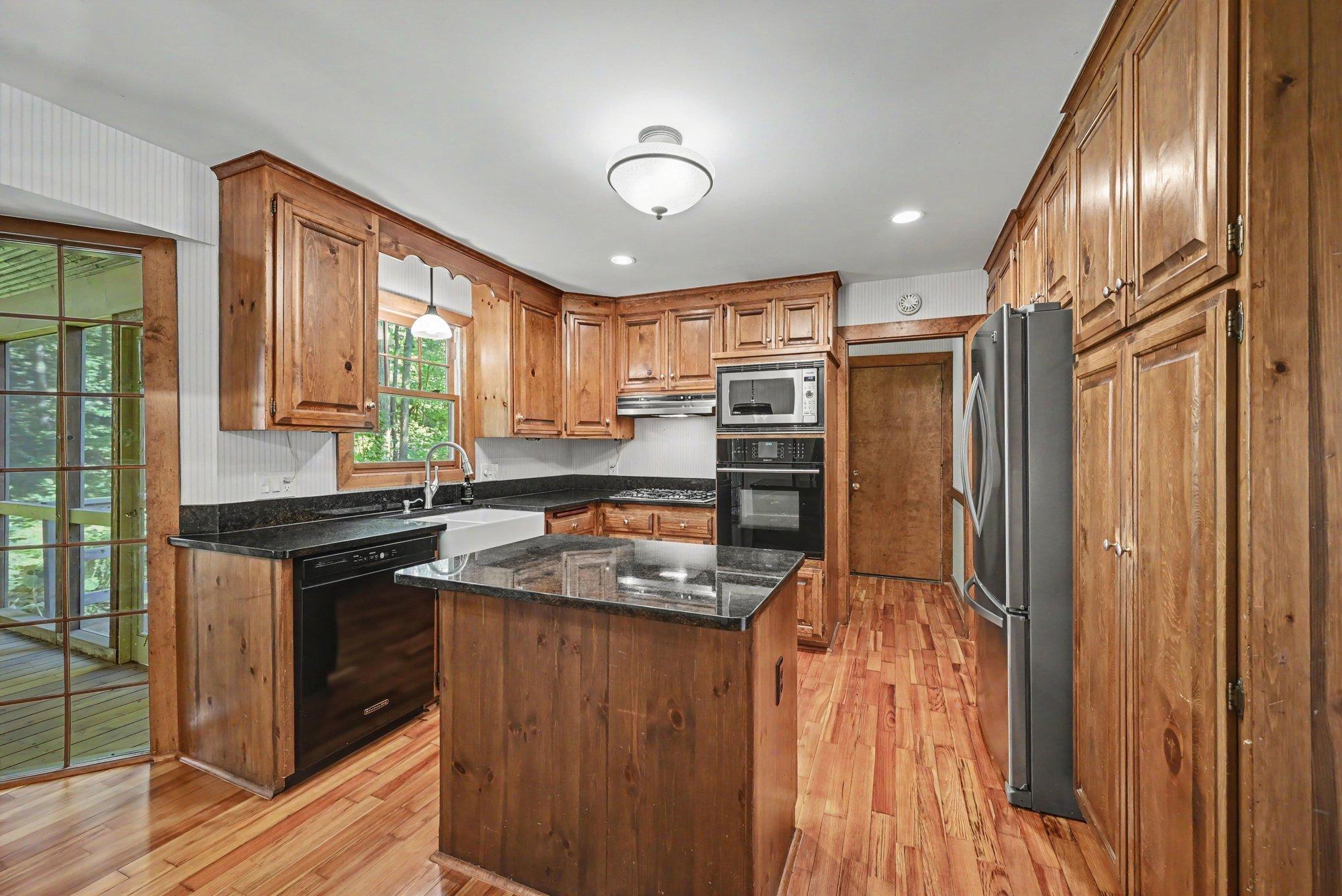 Granite countertops, recently refinished wood floors.