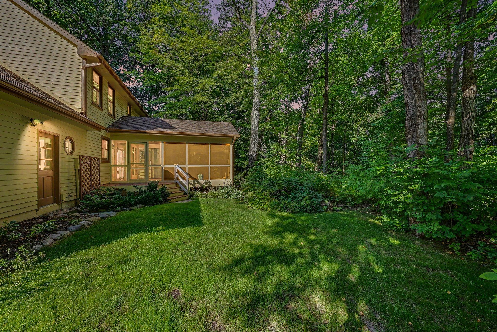 Backyard is wooded and private. Over half acre lot.