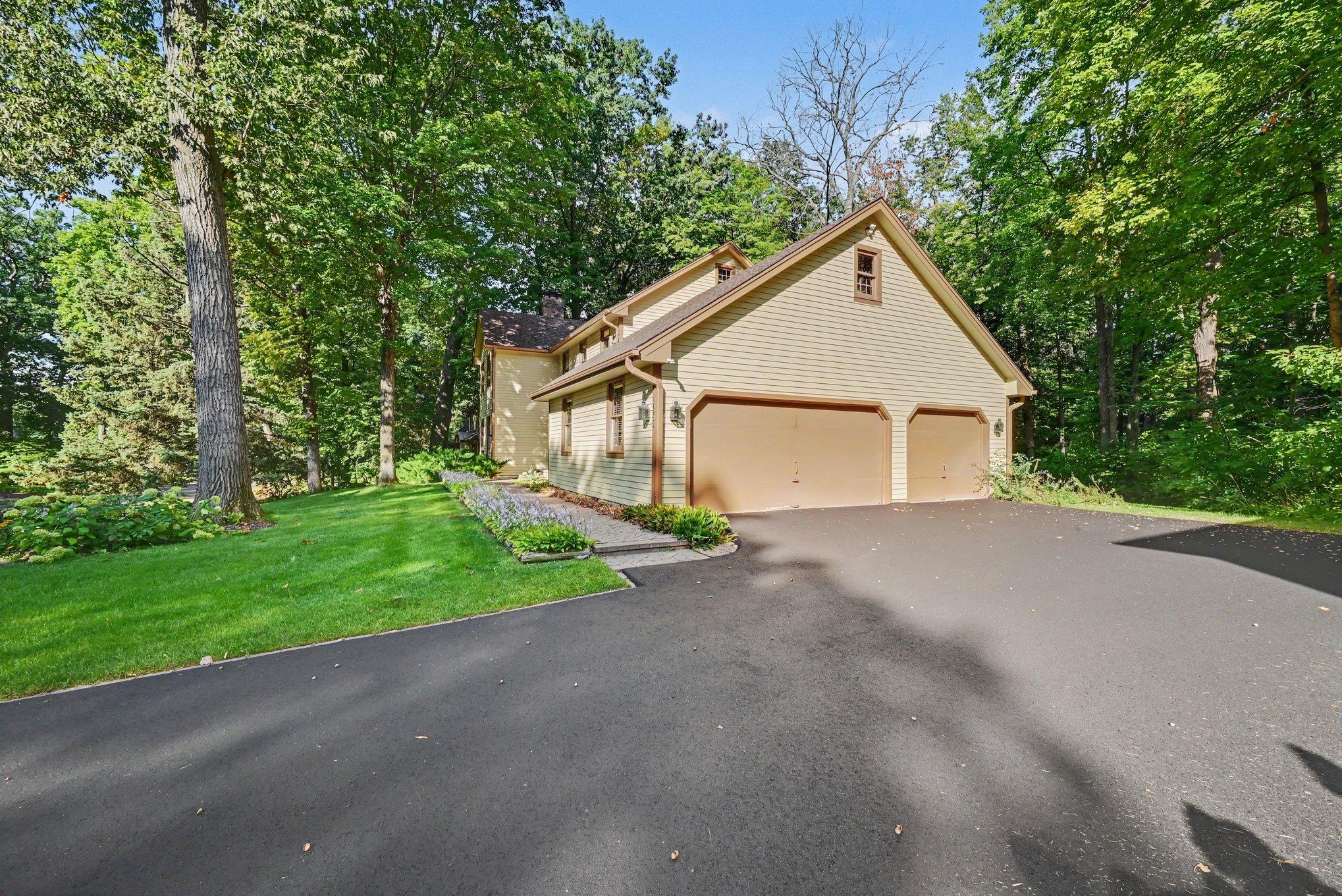 Huge 3 car garage and brand new driveway.