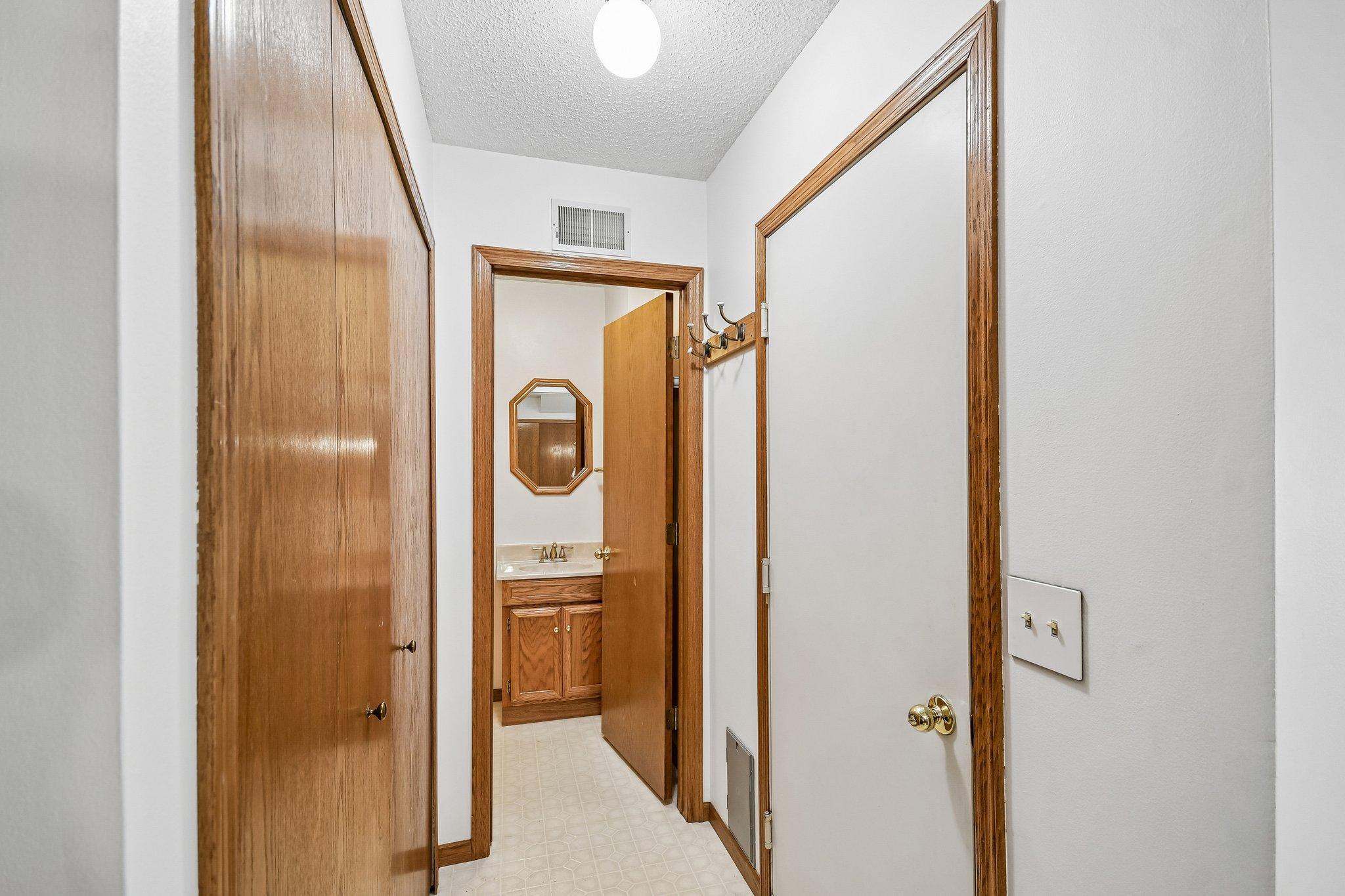 Hallway off kitchen to garage, laundry closet and bathroom
