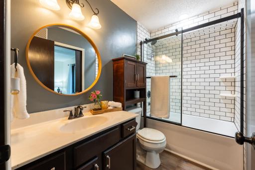 The upper-level full bathroom was updated in 2020 with a tiled tub surround, new shower door and updated fixtures.