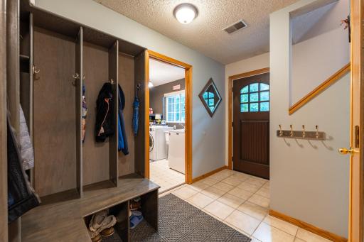 The entry foyer is spacious and organized. Everyone gets their own cubby!