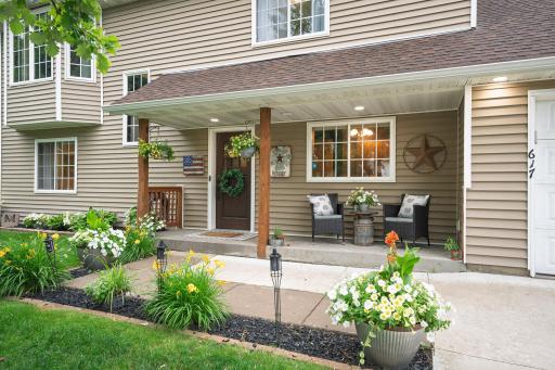 AÂ new front door (2022), updated posts (2025), soffit lighting, and a built-in Bluetooth surround system.