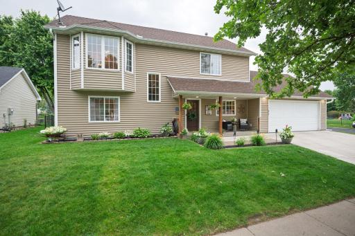 The home has beautiful curb appeal with colorful perennial flowers and a brand-new concrete driveway in 2024.