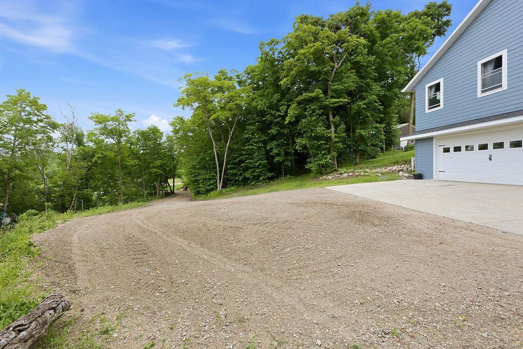 Gravel driveway, plenty of space for parking, guests, entertaining & more