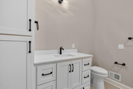 Private Full Bedroom features linen closet, enameled vanity cabinet w/ quartz countertop and luxury vinyl tile flooring