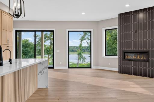 Full glass patio door with access to the covered patio and shared greenspace
