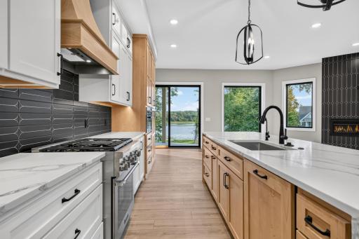 Quartz countertops with decorative tile backsplash