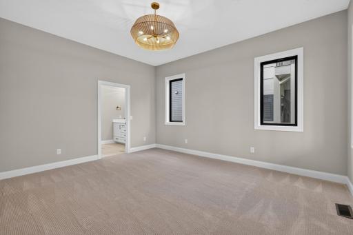 Master Bedroom features large windows that offer park views