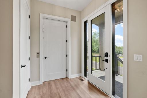 Entry features full glass entry door and sidelights