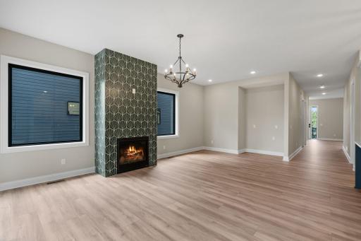 Gas fireplace with decorative tile surround. Large Niche ready for a serving piece or built-in buffet!