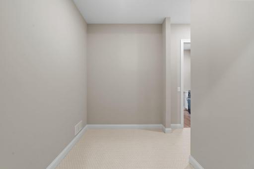 Generously sized walk-in closet with walk-through access to the Laundry Room