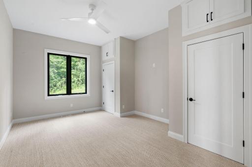 Bedroom 3 features pair of closets with unique storage above