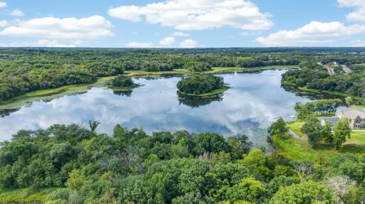Wake to peaceful water views streaming through floor-to-ceiling windows, stroll your private shoreline trail through the trees, or launch a canoe or paddleboard right from the community dock.