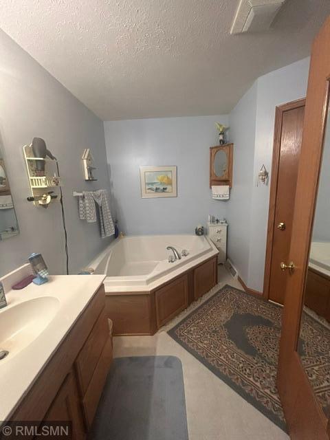 main bath with soaking tub and separate shower