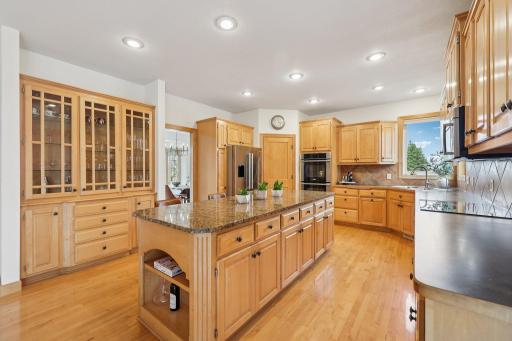 Custom built-ins and walk-in pantry provides generous storage