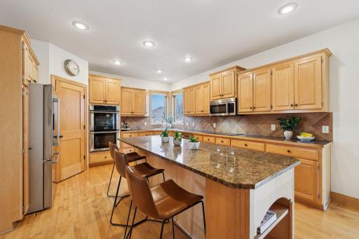 Oversized granite island is the perfect space for everyday living and entertaining