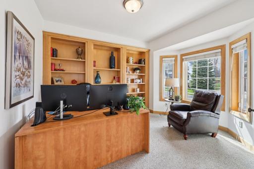 Main level office with bay window provides plenty of natural light