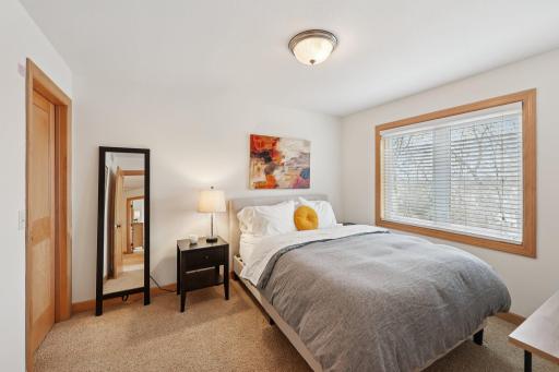 large upper-level bedroom with walk-in closet
