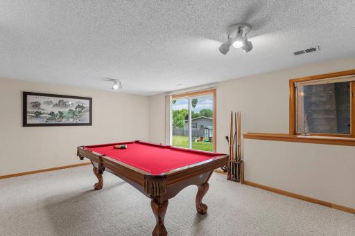 Walkout lower level family room has replaced carpeting and sliding glass door. The seller will leave the slate pool table & equipment for the buyer or remove it at the buyer's choice.