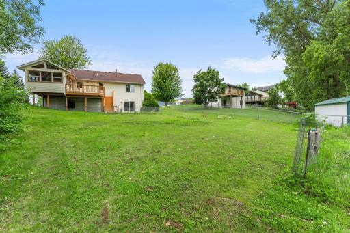 Deep private backyard view from rear lot line. The lot is wider and deeper in the backyard.