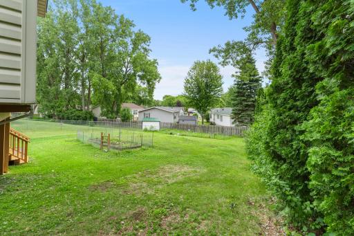 View from the porch to the back of the lot goes to the rear fence line. Shows 1 of the 2 vegetable gardens.