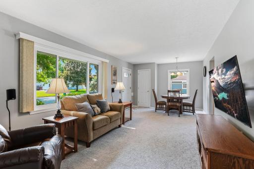 Hardwood floors lie beneath the existing living room carpet, offering buyers an easy opportunity to reveal timeless, real-wood flooring for an instant upgrade in warmth and value.