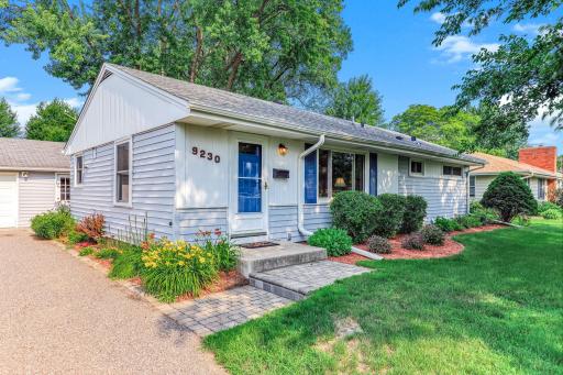 Thoughtfully maintained landscaping with mature greenery, clean garden lines, and seasonal plantings that frame the home beautifully.