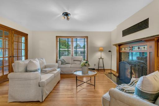 The fireplace is equipped with a Heatilator fan system that efficiently circulates warmth throughout the space, creating a cozy atmosphere during Minnesota winters.