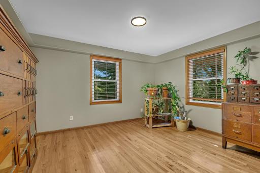 Hardwood flooring continues through the upper hallway and additional bedrooms.