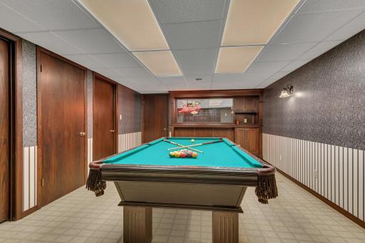 The pool table, balls, cues, and rack are included, making this a ready-to-enjoy gathering space from day one.