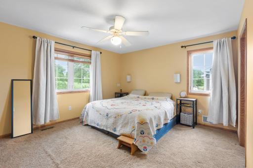 large primary bedroom with ensuite and walk in closet