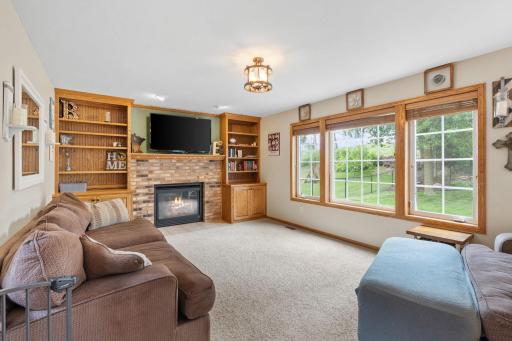 living room with fireplace and huge windows