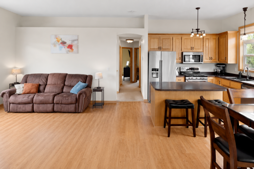 Open-concept main floor boasting soaring 10-foot ceilings and elegant transom windows that flood the home with natural light