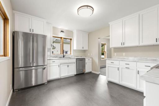 Great kitchen! Fully updated, brand new stainless steel appliances, and naturally bright with natural light and white cabinets.